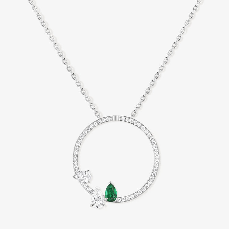 Serti sur Vide pendant set with 2 diamonds and 1 emerald