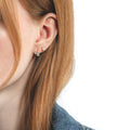 Boucle d'oreille Serti sur Vide sertie de 3 diamants